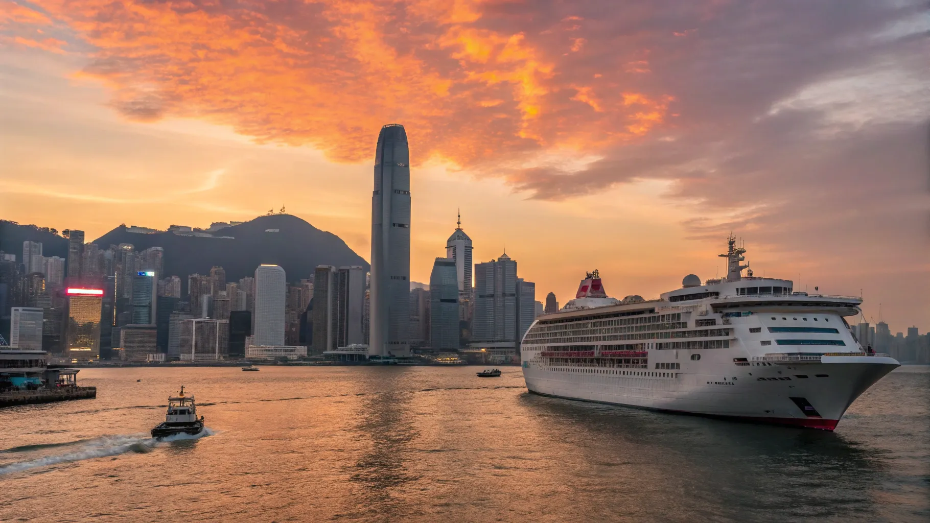 東京発香港着クルーズ: A majestic ship navigating towards Hong Kong's stunning skyline.
